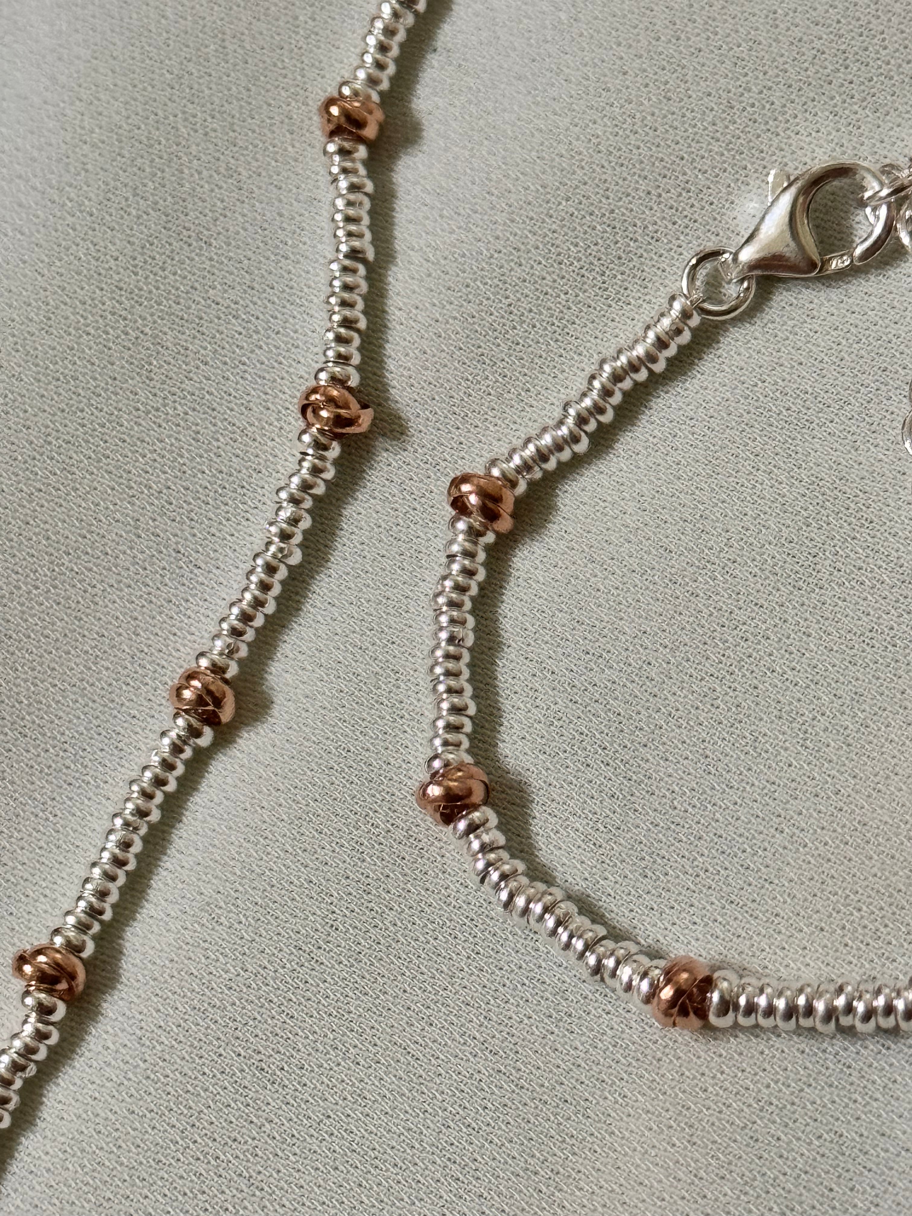 Bracciale Rondelline e Nodini Rosa