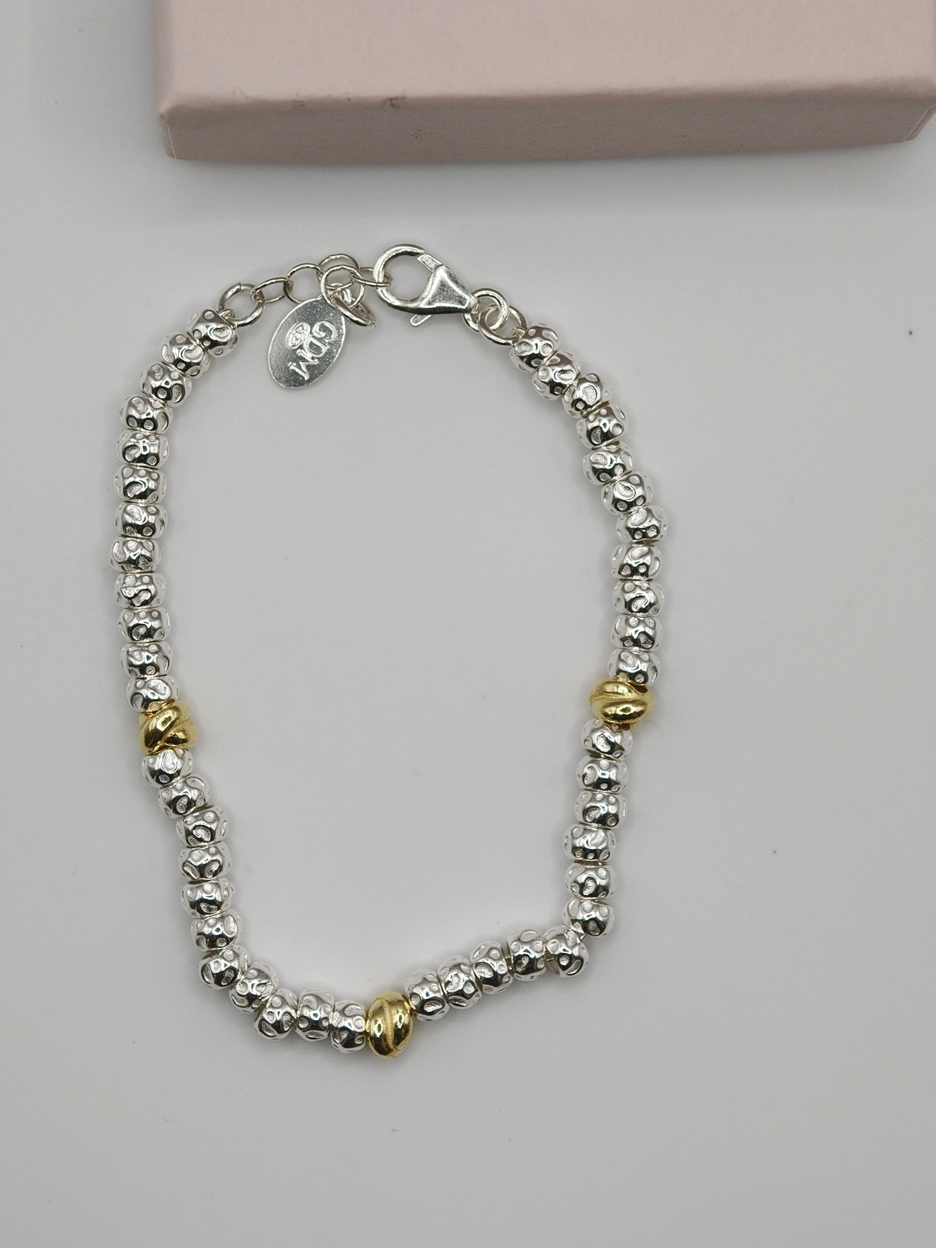 Bracciale Granelli Bombati e Tondeggianti con Nodini