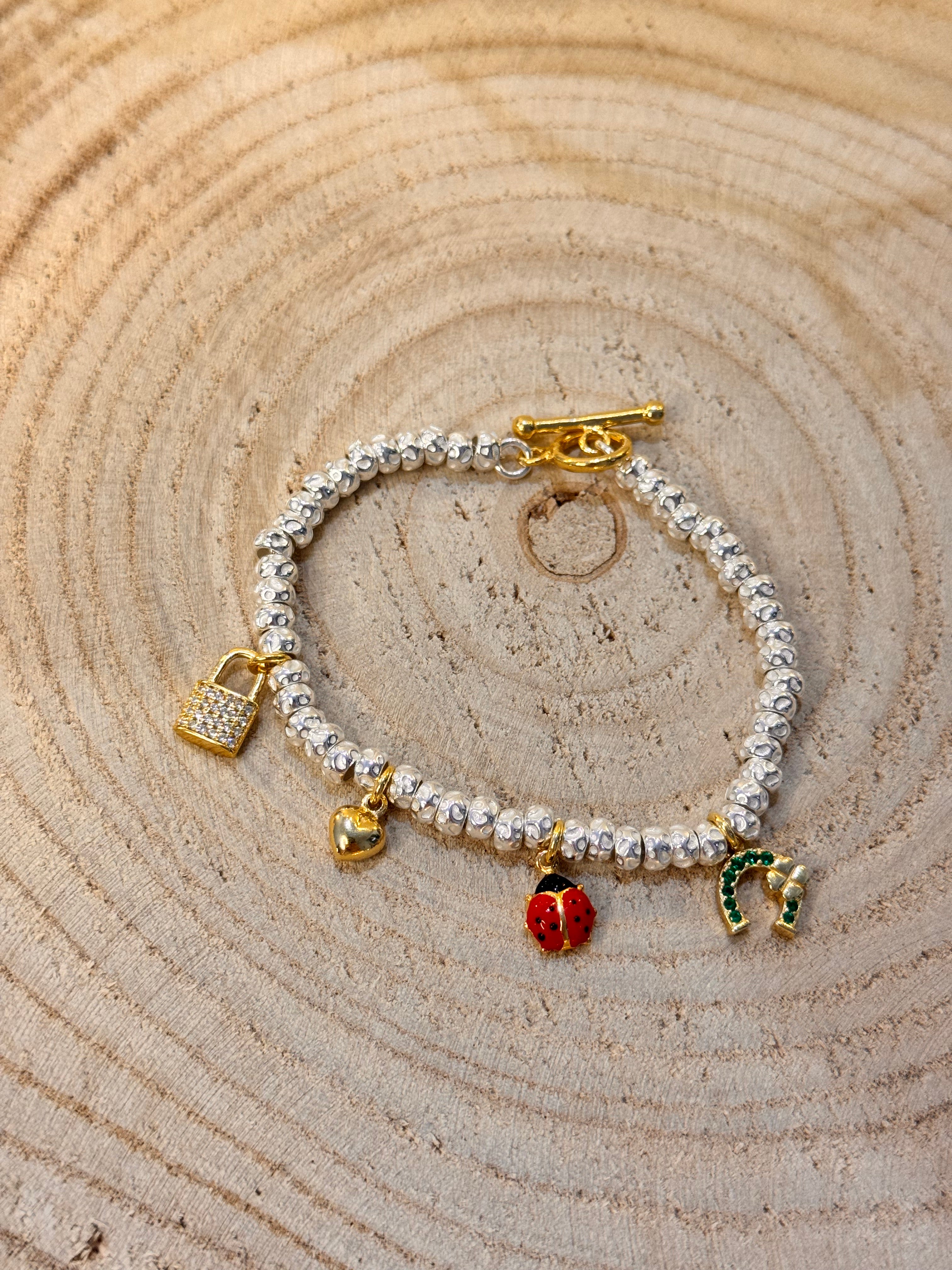 CREA IL TUO BRACCIALE GRANELLI BOMBATI E TONDEGGIANTI - Argento e Oro